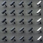 Surveillance cameras on wall